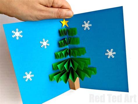 The tabs created above allow the card to close flat but to pop up when opened. DIY Christmas Pop Up Card | Pop up christmas cards, Christmas cards to make, Christmas card crafts