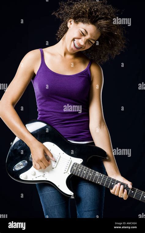 Girl Playing Electric Guitar Stock Photo Alamy