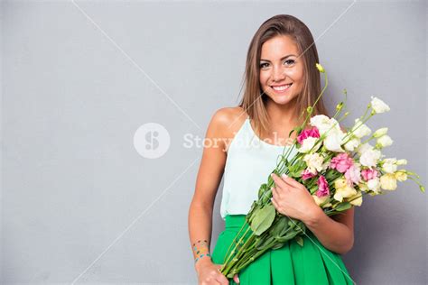 Happy Woman Holding Flowers Royalty Free Stock Image Storyblocks
