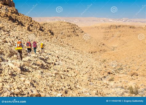 Four Backpackers Hiking Trail Negev Desert Israel Stock Photo