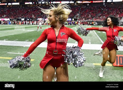 an atlanta falcons cheerleader performs during the first half of an nfl game at mercedes benz