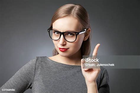 Strict Beautiful Woman Pointing With Index Finger Stock Photo