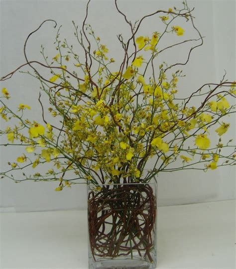This Is An Arrangement Featuring Yellow Oncidium Orchids With Curly Willow Accents See Our