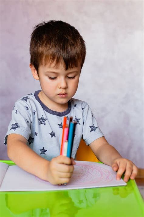 Little Boy Drawing With Color Pencils There Are Many Colored Pencils
