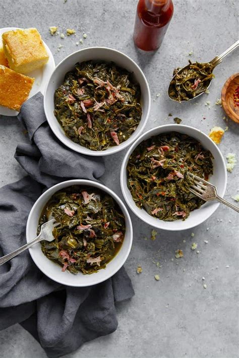 These authentic soul food collard greens are braised in a savory meat flavored and perfectly spiced pot liquor resulting in an amazing tender silky texture. Southern Collard Greens Recipe - Grandbaby Cakes