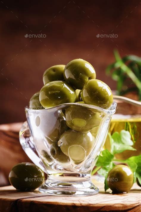 Green Greek Olives In Glass Bowl By 5ph Green Greek Olives In Glass Bowl On The Vintage Wooden