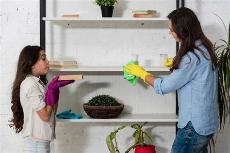 free photo mother and daughter cleaning together
