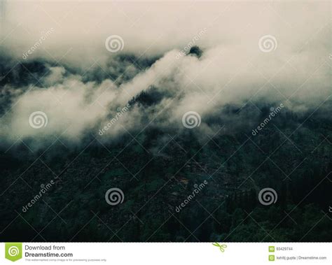 Mountain With Heavy Clouds Stock Photo Image Of Peeping 93429744