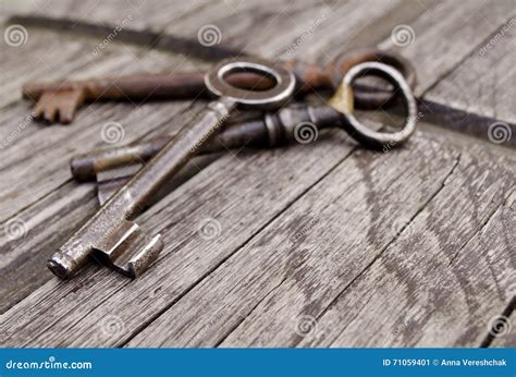 Vintage Keys On Old Wooden Background Close Up Three Old Rustic Keys