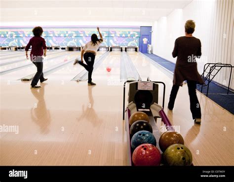 Three Women Ten Pin Bowling Strikes Bowling Alley Ely UK Stock