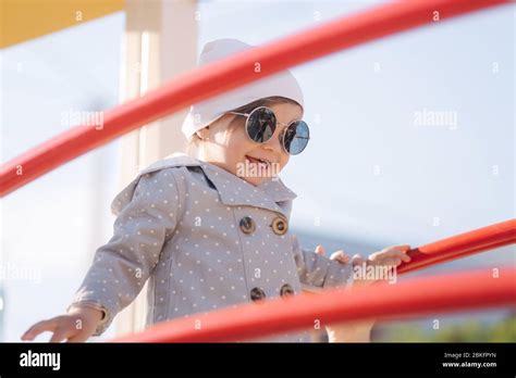 Cute Little Girl Walk In Playground And Have Fun Adorable Girl In
