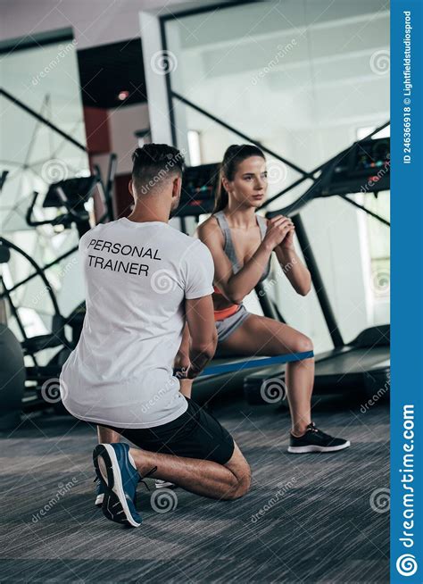 Back View Of Personal Trainer Controlling Stock Photo Image Of