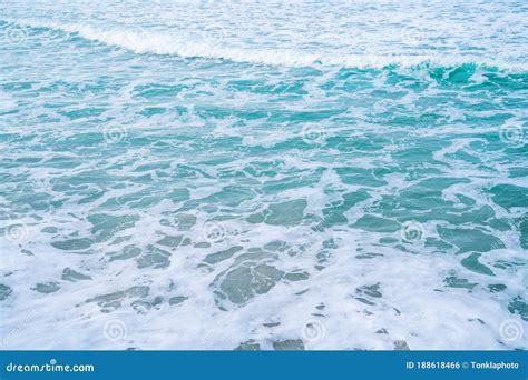 Soft Blue Ocean Wave On Sandy Beach Background Textured Stock Photo