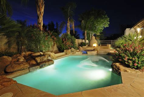 Glowing Desert Pool With Rock Landscaping Scottsdale Arizona