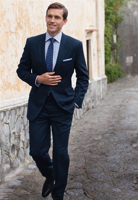It's a navy or grey suit with a white shirt underneath. All Suited up | Dark blue suit, Suit combinations, Men's suits