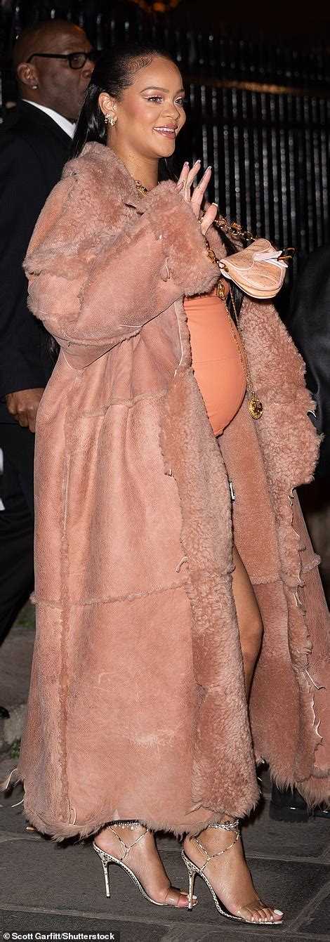 Pregnant Rihanna Highlights Her Baby Bump In A Leather Mini Dress At