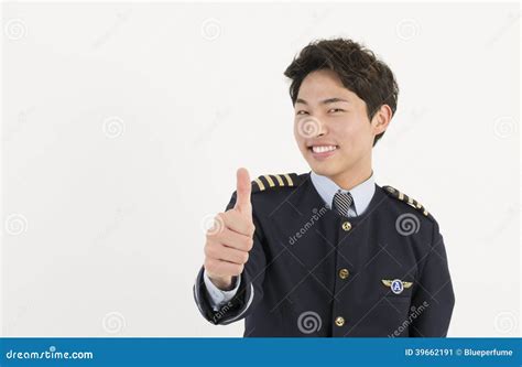 Cheerful Airline Pilot Wearing Uniform With Thumb Up Gesture Of