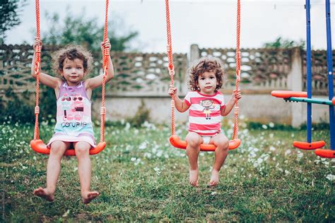 Two Young Girls Playing In The Backyard By Stocksy Contributor Koki Jovanovic Stocksy