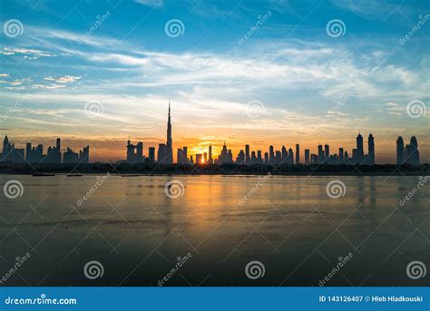 Morning Or Sunrise In Dubai Dawn Over Burj Khalifa Beautiful Colored Cloudy Sky Over Downtown