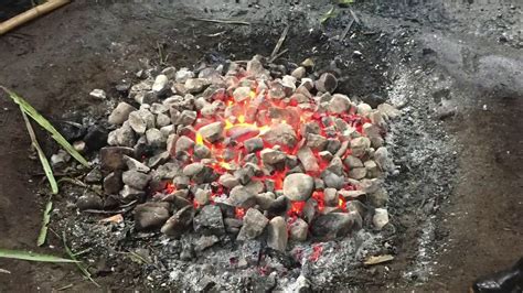Fijian Lovo Food Cooked Over White Hot Rocks See The Fire Pit And The