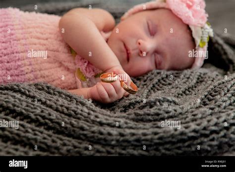Sleeping Newborn Girl On A Pink Backgroundphotoshoot For The Newborn
