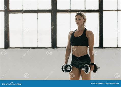 Athletic Woman In Sportswear With Smart Watch Doing Fitness Workout