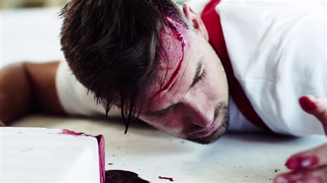 Download lying on floor stock vectors. A close-up of a man worker with bleeding wound on head ...