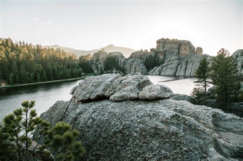 Photo Of Rock Formations Near Forest · Free Stock Photo