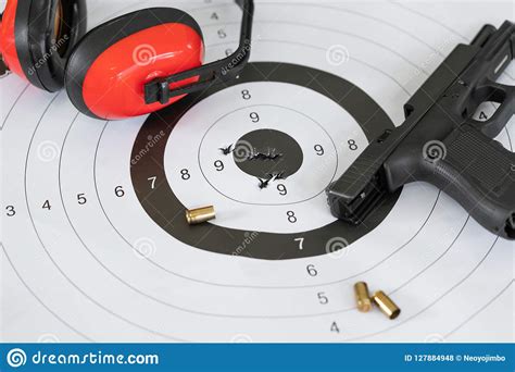 Close Up Shot Of A Shooting Target And Bullseye With Bullet Holes With