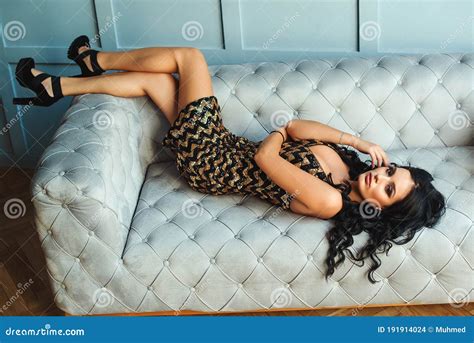 Sensual Brunette Woman Posing On Sofa Women Fashion Girl With Perfect Body Woman`s Legs In