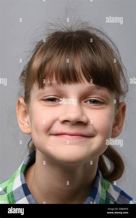 Portrait Of A Happy Ten Year Old Girl Of European Appearance Close Up