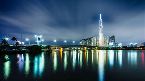 Download Wallpaper 2560x1440 Night City Buildings Architecture River Lights Widescreen 169