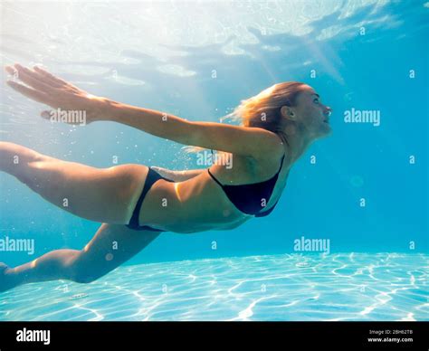 Woman Underwater At The Swimming Pool Stock Photo Alamy
