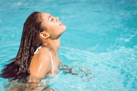 beautiful woman in white bikini relaxing in swimming pool stock image image of feminine