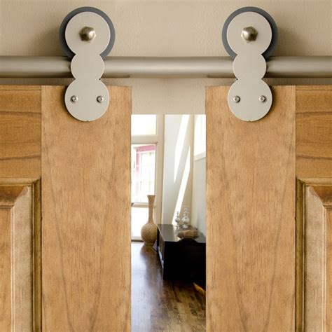 The rolling barn door design implements smooth rolling wheels that are installed and glides on the metal rolling door hardware kit offers many accessories to compliment your door and hardware. Is an Interior Barn Door Right for Your Home? | Dengarden