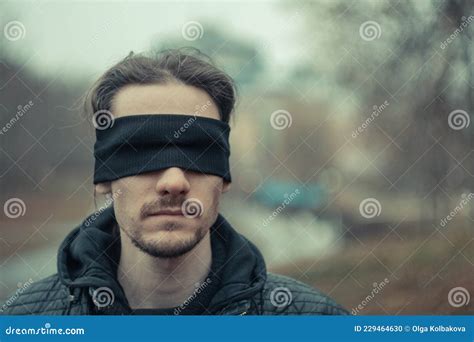 A Man With A Black Blindfold Over His Eyes Stock Photo Image Of