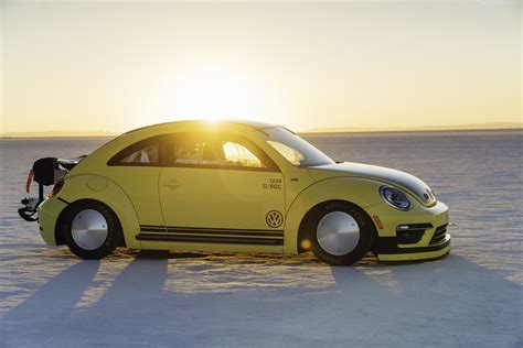 Photo Of Yellow Volkswagen New Beetle On Seashore Hd Wallpaper