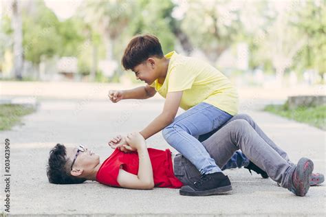 Asian Boy Student Or Children Getting Bullied On Outdoor School