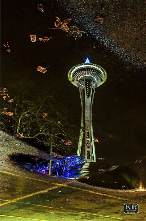 The Seattle Space Needle Reflection In A Puddle Kr Backwoods