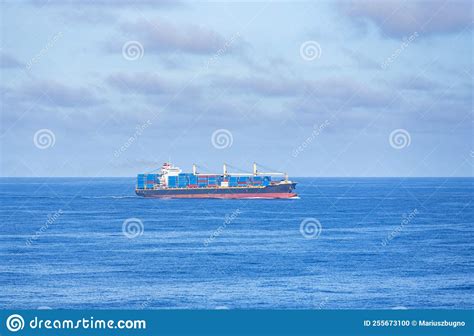 Cargo Ship Sailing Through The Calm Sea Stock Photo Image Of Carrier