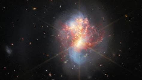 Nasas James Webb Telescope Snaps Distant Pair Of Colliding Galaxies