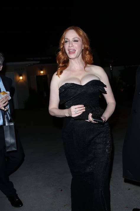 Christina Hendricks And George Bianchini Arrives At A Holiday Party In