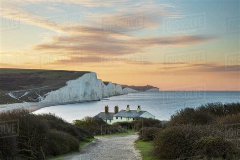 Seven Sisters And Beachy Head With Coastguard Cottages At Sunrise In