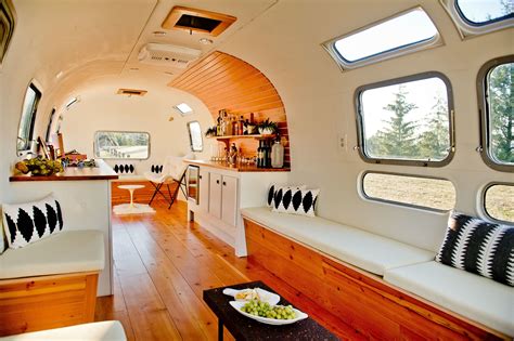 The Inside Of A Tiny Home With Lots Of Windows