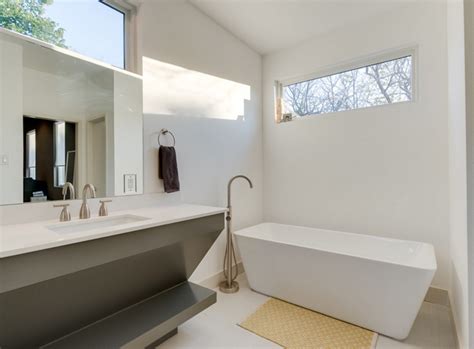 A massive primary bathroom boasting marble tiles flooring and a large deep soaking tub under the vaulted ceiling with skylights. 20 Contemporary Bathrooms with Vaulted Ceiling | Home ...