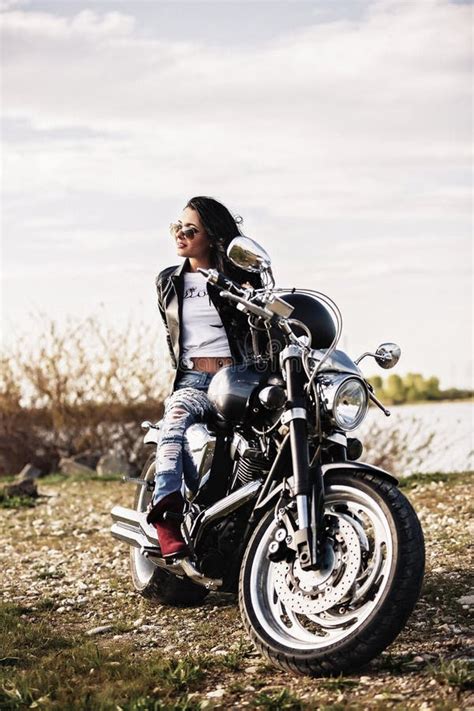 Beautiful Motorcycle Brunette Woman With A Classic Motorcycle C Stock