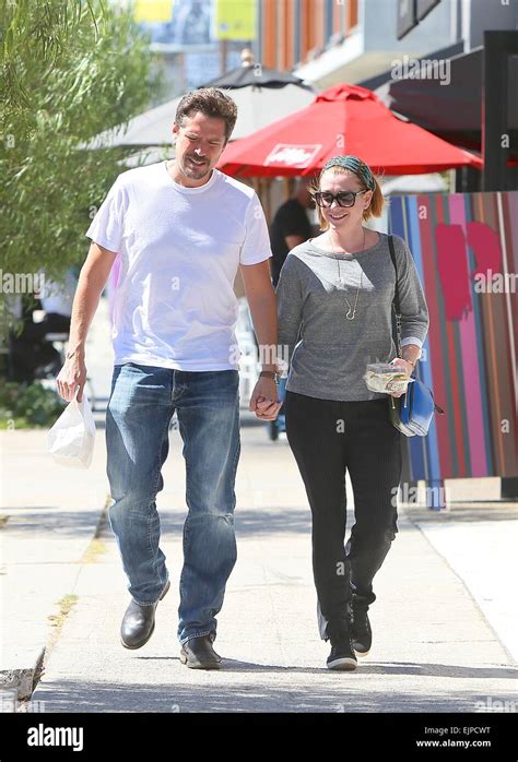alyson hannigan and her husband alexis denisof spotted leaving toast bakery cafe featuring