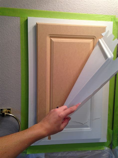 Have a laminate cabinet doors you want to update? The ragged wren : Painting Laminated Cabinets
