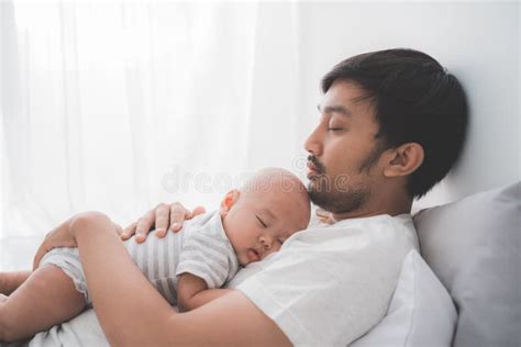 Dad With His Infant Boy Sleeping On His Chest Stock Image Image Of