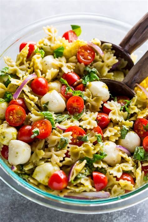 Pasta Salad With Tomatoes Mozzarella And Basil In A Glass Bowl